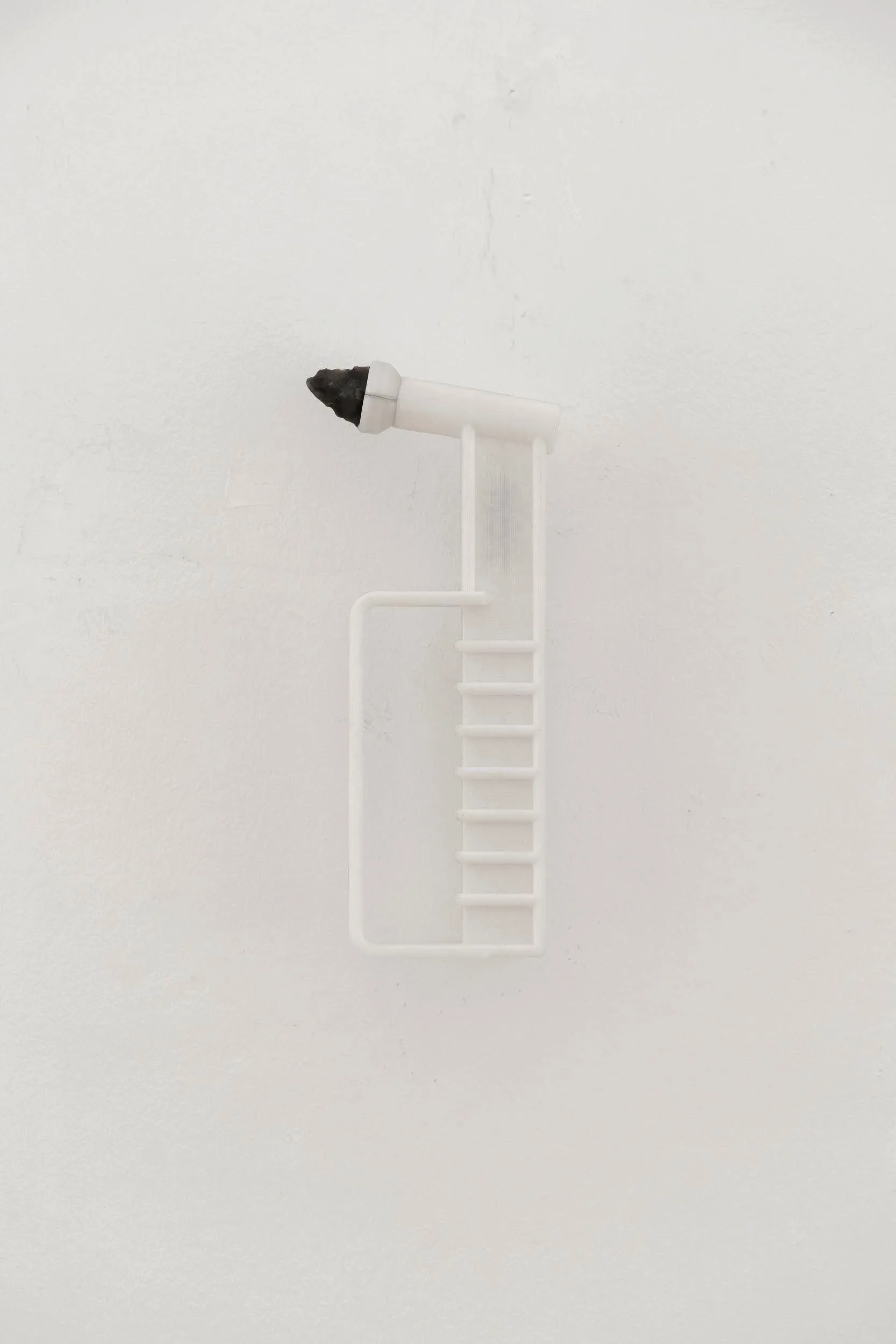 Safety Hammer object, a fragment of the installation It is not About Time - magnetic mounting allows the object to be picked up